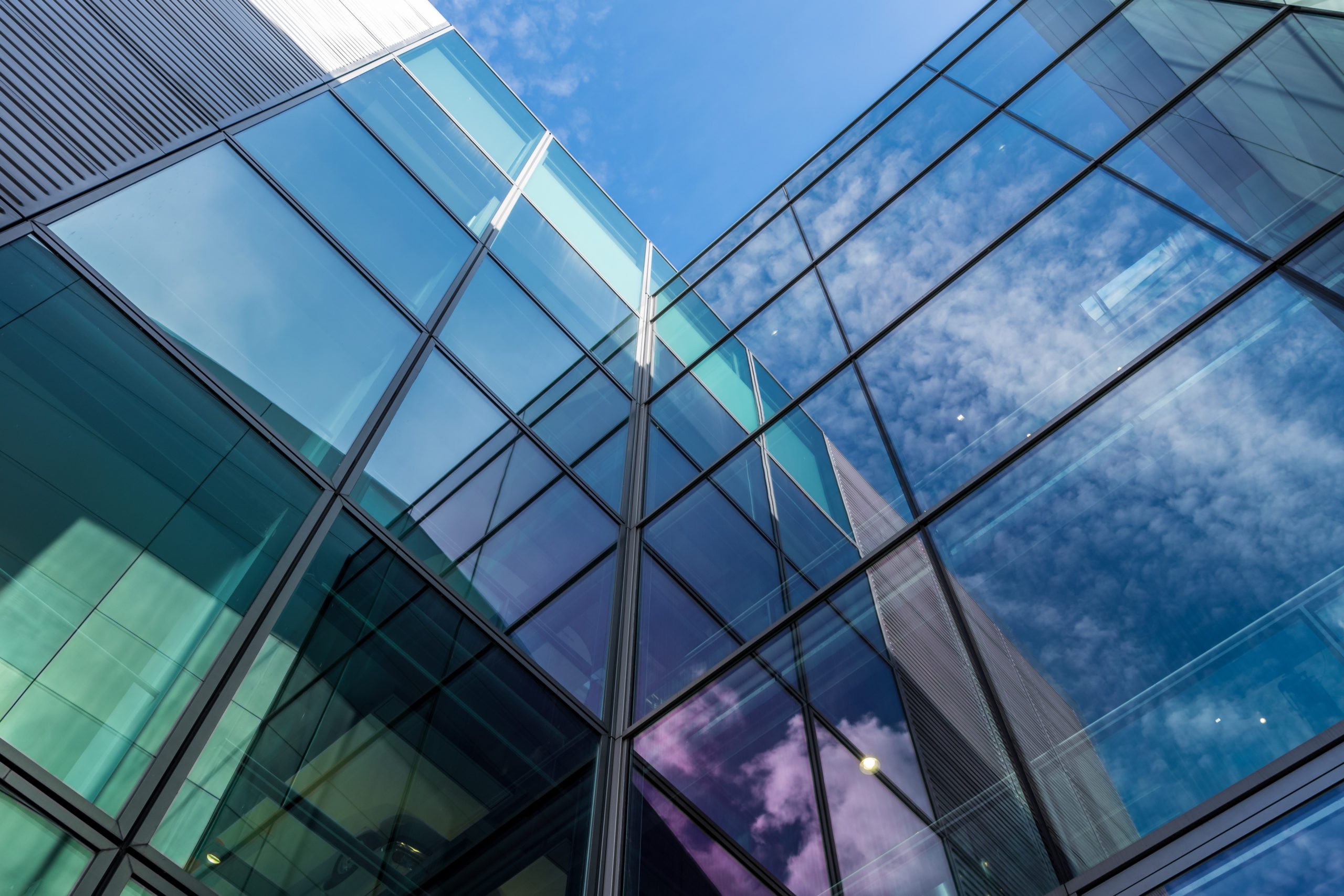 The glass architecture in city against a sky